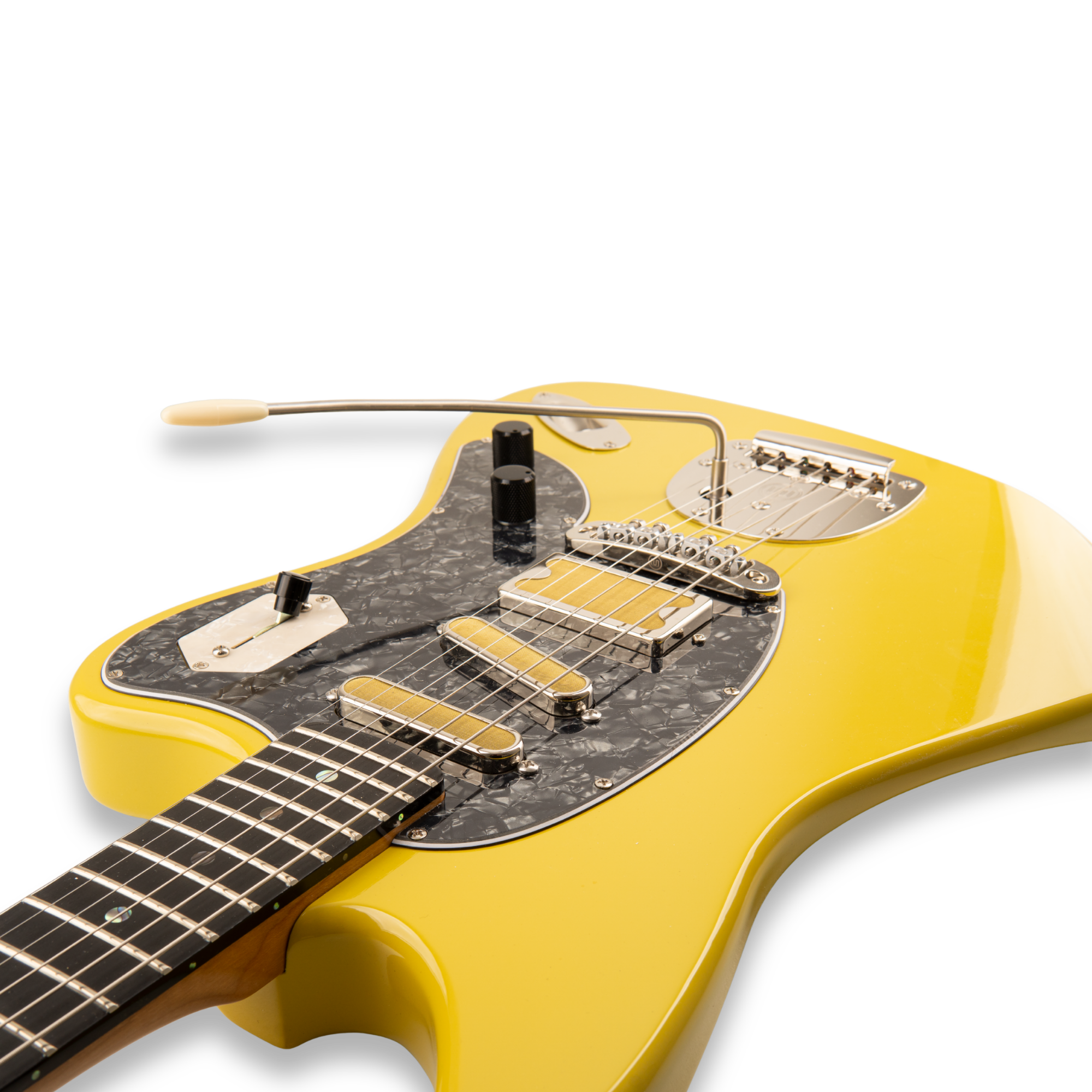 Angled close-up of the yellow Amigo Del Surf body, bridge and offset vibrato