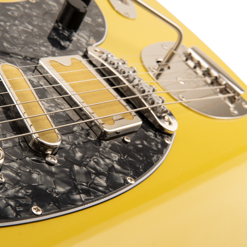 Close-up of the Amigo Del Surf bridge, pickup and offset vibrato hardware
