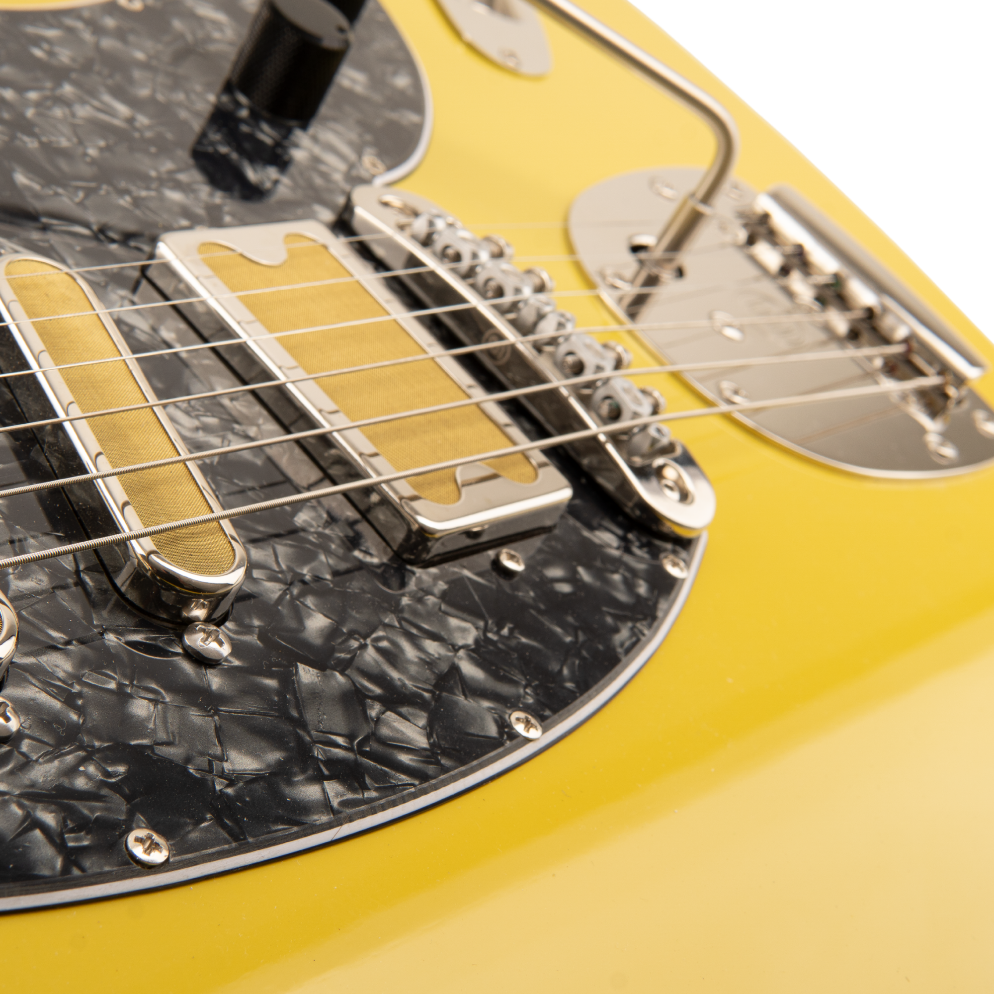 Close-up of the Amigo Del Surf bridge, pickup and offset vibrato hardware